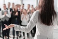 Young business woman looking at her business team. Royalty Free Stock Photo