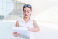 Young business woman looks at his watch and smiles Royalty Free Stock Photo