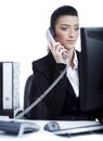 Young business woman making a phone call at office Royalty Free Stock Photo