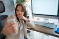 Young business woman making selfie while working on computer Royalty Free Stock Photo