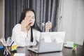 Young business woman person sleepy and has frustration eye problems with cephalalgia disease from using laptop computer on her Royalty Free Stock Photo