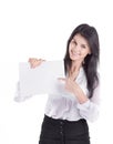Young business woman pointing to a blank piece of paper Royalty Free Stock Photo