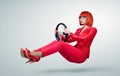 Young business woman in red driver car with a wheel