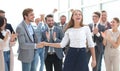 Young business woman shaking hands with her colleague Royalty Free Stock Photo