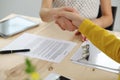 Young business woman shaking hands after signing contract Royalty Free Stock Photo