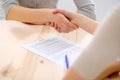 Young business woman shaking hands after signing contract Royalty Free Stock Photo