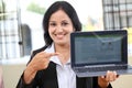 Young business woman showing tablet computer Royalty Free Stock Photo