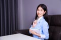 Business woman sitting at the desk and thinking to her work Royalty Free Stock Photo