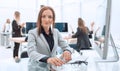 young business woman sitting at office Desk. Royalty Free Stock Photo