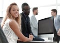 Young business woman sitting at office Desk Royalty Free Stock Photo