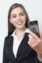 Young business woman is smiling while taking a selfie pciture Royalty Free Stock Photo