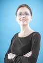 Young business woman standing with folded hands Royalty Free Stock Photo