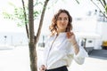 Young business woman standing on the street Royalty Free Stock Photo