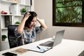 Young business woman stressed from work in home office Royalty Free Stock Photo