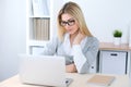 Young business woman or student girl sitting at office workplace with laptop computer. Home business concept Royalty Free Stock Photo