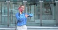 Young business woman talking on the phone in a financial district. Enterprising woman