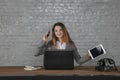 Young business woman talking on the phone, holding calculator in her hand Royalty Free Stock Photo