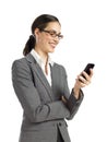 Young business woman texting on phone