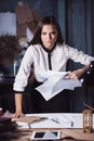 Young business woman throwing documents at camera. Royalty Free Stock Photo