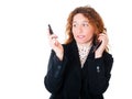 Young business woman with two mobile phones Royalty Free Stock Photo