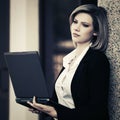 Young business woman using laptop at office building Royalty Free Stock Photo