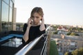 Young business woman using smart mobile phone, outside office building and speaking with a business partners. Business Royalty Free Stock Photo