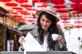 Young business woman is working in a cafeteria in her break. Student studying from coffee shop. Enjoying work from coffee shop. Royalty Free Stock Photo