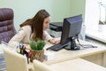 Young business woman working hard over the Desk in the study, economist accountant financial reporting, verifies accuracy of docum Royalty Free Stock Photo