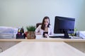 Young business woman working hard over the Desk in the study, economist accountant financial reporting, verifies accuracy of docum Royalty Free Stock Photo