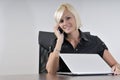 Young business woman working in office on laptop Royalty Free Stock Photo