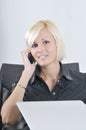 Young business woman working in office on laptop Royalty Free Stock Photo