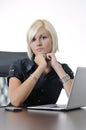 Young business woman working in office on laptop Royalty Free Stock Photo