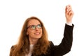 Young business woman writting with marker on a transparent board