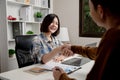 Young business women handshake with partnership