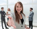 Young business woman holding out her hand for a handshake Royalty Free Stock Photo