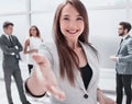 Young business woman holding out her hand for a handshake Royalty Free Stock Photo