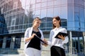 Young business woman signing contract outside business center in big city Royalty Free Stock Photo