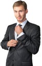 Young businessman adjusting his tie Royalty Free Stock Photo