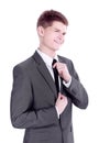 Young businessman adjusting his tie.isolated on a white Royalty Free Stock Photo