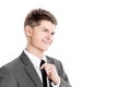 Young businessman adjusting his tie.isolated on a white Royalty Free Stock Photo