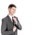 Young businessman adjusting his tie.isolated on a white Royalty Free Stock Photo