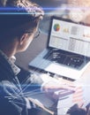Young businessman analyze stock report on notebook screen.Concept of digital screen,virtual connection icon,diagram