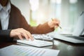 Young Businessman Analyzing Graph On Computer At Workplace Royalty Free Stock Photo