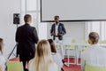 Young businessman asks the speaker at a business meeting. Business concept Royalty Free Stock Photo