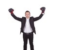 Young businessman with boxing gloves raising his arms