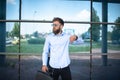 Young businessman with a briefcase and glasses