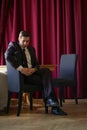 A young businessman came to lunch in a cafe, he sits at a table and waits someone