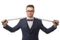 Young businessman with chains on hands and shoulders Royalty Free Stock Photo