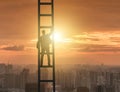 Young businessman climbing career ladder