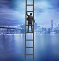 Young businessman climbing career ladder Royalty Free Stock Photo